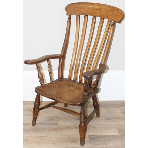 60 - An antique slat backed Windsor farmhouse armchair with elm seat, approx 61cm wide x 103cm tall