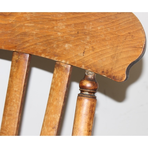 60 - An antique slat backed Windsor farmhouse armchair with elm seat, approx 61cm wide x 103cm tall