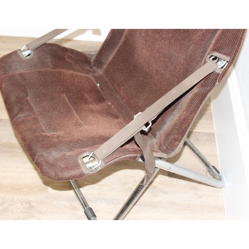 68 - A retro folding armchair with brown corduroy upholstery and chrome tubular frame, approx 66cm wide x... 