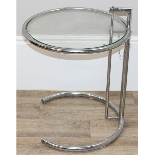 9 - In the manner of Eileen Grey, a retro adjustable side table with glass top and tubular steel frame, ... 