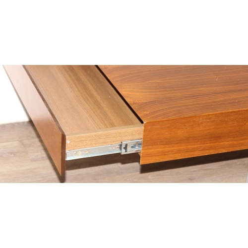 54 - A retro coffee table with figured wooden top and unusual inset metal legs, each end with 2 drawers, ... 