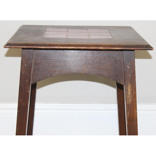 87 - An Arts & Crafts period oak side table with 9 inset red glazed tiles, strongly in the manner of Libe... 