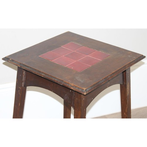 87 - An Arts & Crafts period oak side table with 9 inset red glazed tiles, strongly in the manner of Libe... 