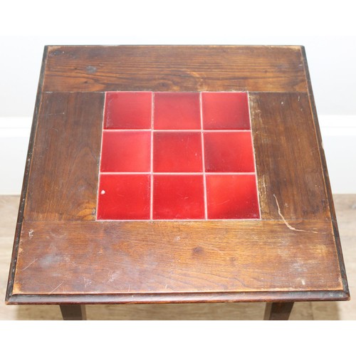 87 - An Arts & Crafts period oak side table with 9 inset red glazed tiles, strongly in the manner of Libe... 