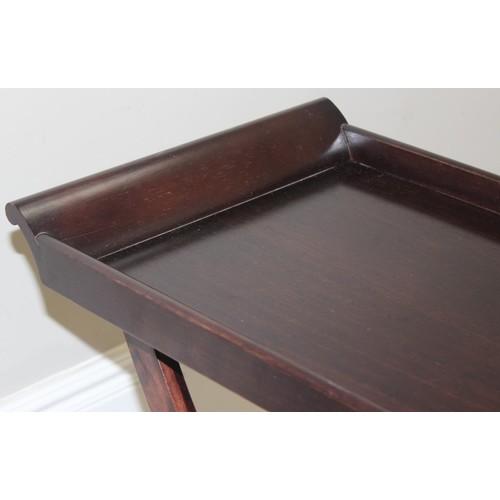 139 - An antique style mahogany butler's tray table on folding stand, 20th century, approx 68cm wide x 38c... 