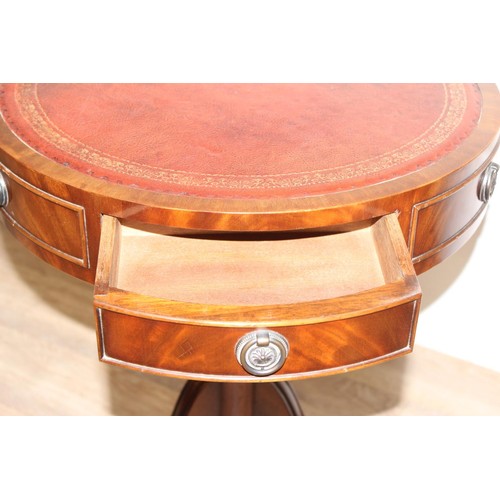 92 - An antique style mahogany drum table with 3 drawers and 3 faux drawers, red gilt tooled inset leathe... 