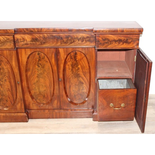 35 - A Victorian mahogany breakfront sideboard, 2 side cupboards flanking a central cupboard, one of the ... 