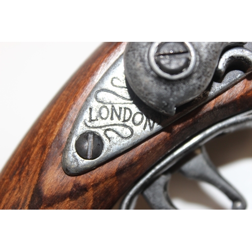 1404 - Replica weapons: Double-barelled London flintlock pistol, French long flintlock pistol and a Hadley ... 