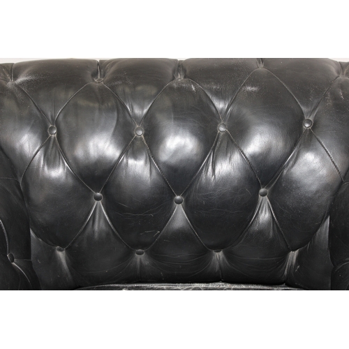 52 - 2 black leather Chesterfield buttoned club armchairs, each approx 128cm wide x 100cm deep x 65cm tal... 