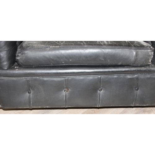 52 - 2 black leather Chesterfield buttoned club armchairs, each approx 128cm wide x 100cm deep x 65cm tal... 