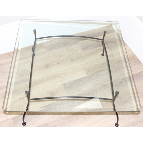 50 - 2 glass topped and wrought iron side tables, the largest approx 91cm square x 45cm tall