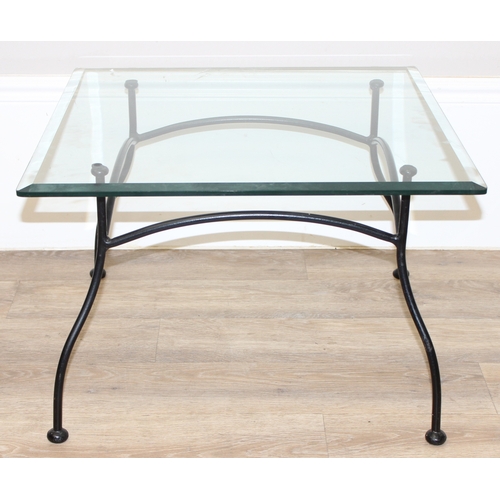 50 - 2 glass topped and wrought iron side tables, the largest approx 91cm square x 45cm tall