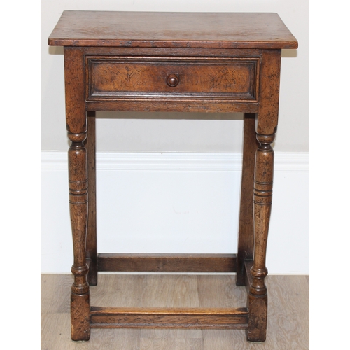 42 - An antique oak side table with single drawer, approx 53cm wide x 38cm deep x 73cm tall