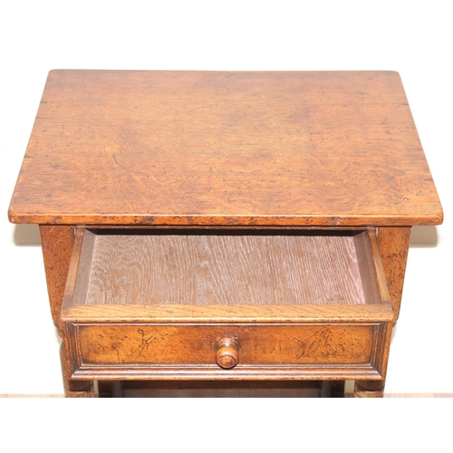 42 - An antique oak side table with single drawer, approx 53cm wide x 38cm deep x 73cm tall