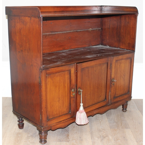 25 - An antique mahogany side hall stand or sideboard of unusual construction, an open recess under a she... 