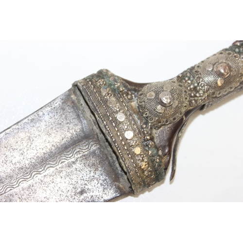 1410 - Large white metal and brass mounted Jambiya dagger, approx 54cm