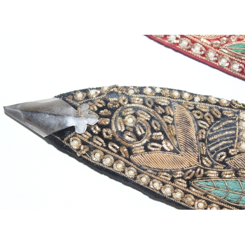 1411 - 2 alloy-hilted Kukri knives, 1 with jewelled-red velvet scabbard, the other longer and with jewelled... 