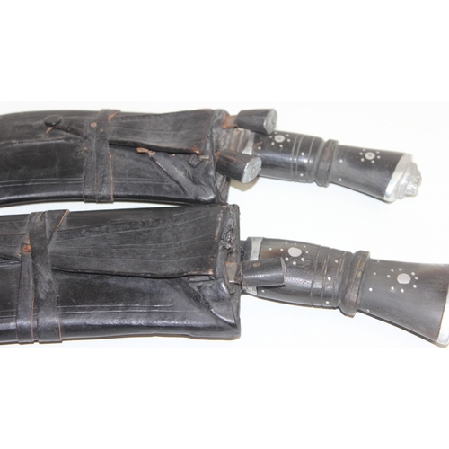 1412 - 2 vintage Kukri knives with leather covered sheaths, longest approx 59cm