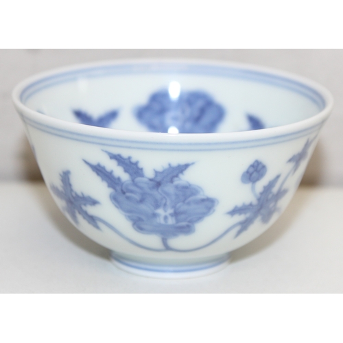 1455 - A Chinese blue & white porcelain tea bowl decorated with floral motifs, Chenghua (1464-1487) 6 chara... 