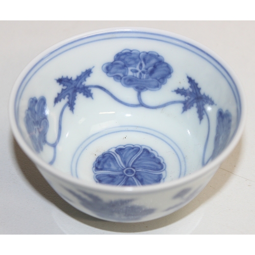 1455 - A Chinese blue & white porcelain tea bowl decorated with floral motifs, Chenghua (1464-1487) 6 chara... 