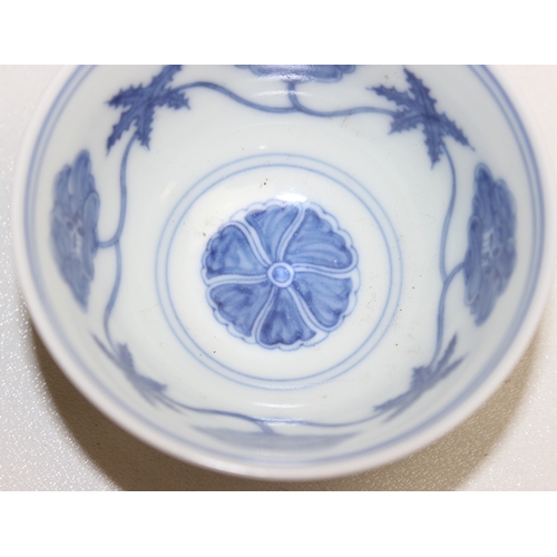 1455 - A Chinese blue & white porcelain tea bowl decorated with floral motifs, Chenghua (1464-1487) 6 chara... 