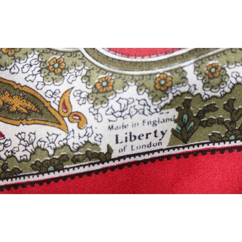 207 - 2 Liberty silk scarves, one of peacock feathers and the other a Paisley design, largest approx 86cm ... 