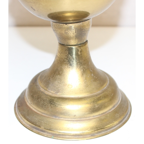 239 - An antique oil lamp with decorative glass shade, an amber coloured glass reservoir, and a cast iron ... 