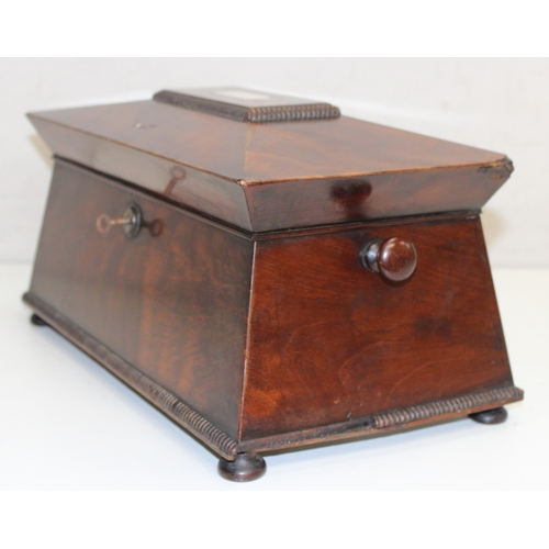 277 - Regency period mahogany sarcophagus tea caddy with Mother of Pearl inlay on bun feet, approx 34cm x ... 