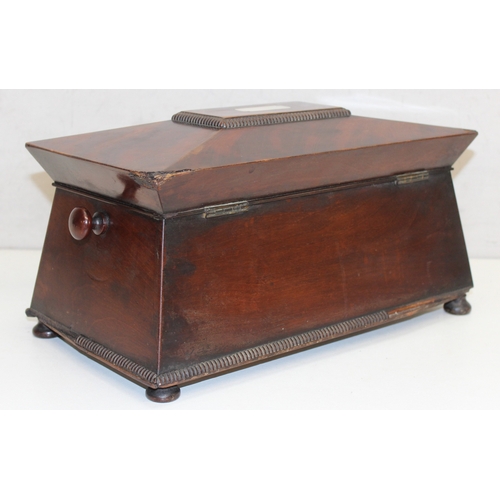 277 - Regency period mahogany sarcophagus tea caddy with Mother of Pearl inlay on bun feet, approx 34cm x ... 