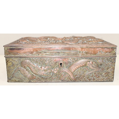 1047 - An Oriental silver plated or antimony jewellery casket decorated with dragons, unusual large size, a... 