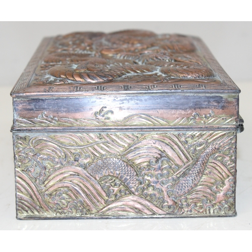 1047 - An Oriental silver plated or antimony jewellery casket decorated with dragons, unusual large size, a... 