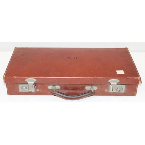 1431 - Vintage leather case initialled G.H., with Masonic contents to incl medals, aprons, gloves, sash and... 