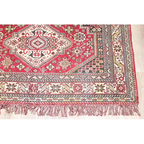 209 - A good quality red ground modern rug, no label, approx 225cm x 140cm