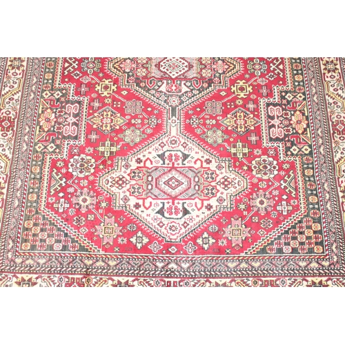 209 - A good quality red ground modern rug, no label, approx 225cm x 140cm