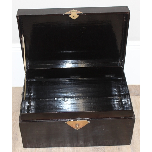 283 - A vintage Oriental black lacquered box with embossed brass fittings, approx 62cm wide x 40cm deep x ... 