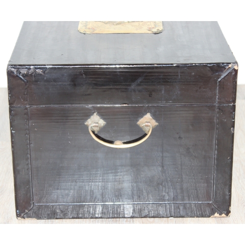 283 - A vintage Oriental black lacquered box with embossed brass fittings, approx 62cm wide x 40cm deep x ... 