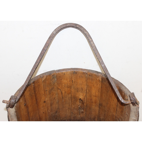 286 - Antique wooden water pale/bucket with iron attachments and banding, possibly Chinese, approx 34cm di... 