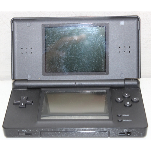 607 - Nintendo DS Lite handheld games console with associated games to incl Brain Training, Puzzler, Touch... 