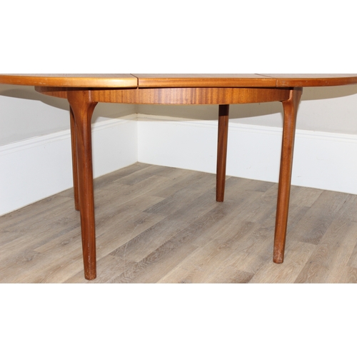 114 - A retro Macintosh Furniture extending circular dining table, label to inside leaf, approx 122cm in d... 