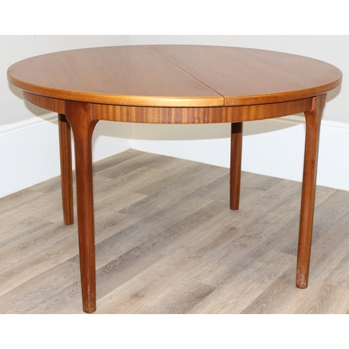 114 - A retro Macintosh Furniture extending circular dining table, label to inside leaf, approx 122cm in d... 