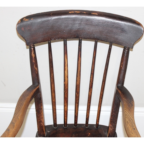 63 - An antique elm seated farmhouse stickback Windsor chair, approx 55cm wide x 99cm tall