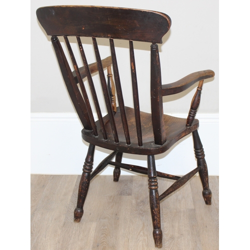 63 - An antique elm seated farmhouse stickback Windsor chair, approx 55cm wide x 99cm tall