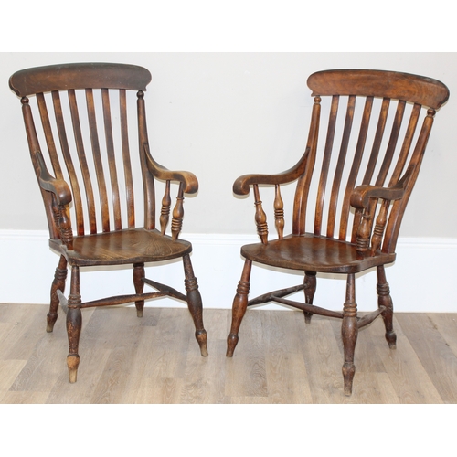 6 - A pair of antique elm seated high slat back Windsor farmhouse armchairs, each stamped JK to back rai... 