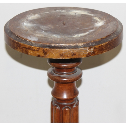 142 - An antique mahogany jardinière stand formed as a reeded pillar with lion paw feet, with an associate... 