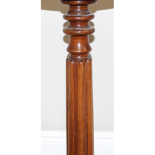 142 - An antique mahogany jardinière stand formed as a reeded pillar with lion paw feet, with an associate... 