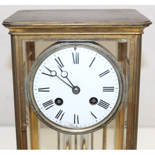 1363 - An early 20th century French four-glass mantel clock with white-enameled dial with Roman numerals, t... 