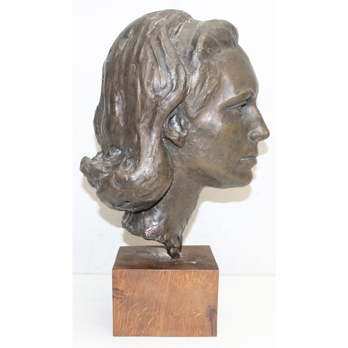 1480 - A mid-century bronze bust or sculpture of a young Lady Newall, mounted on an oak base, seemingly uns... 