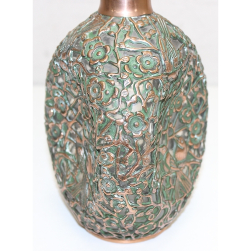 1482 - A highly decorative Haig's Dimple whisky bottle covered in pierced copper work, depicting flowers an... 