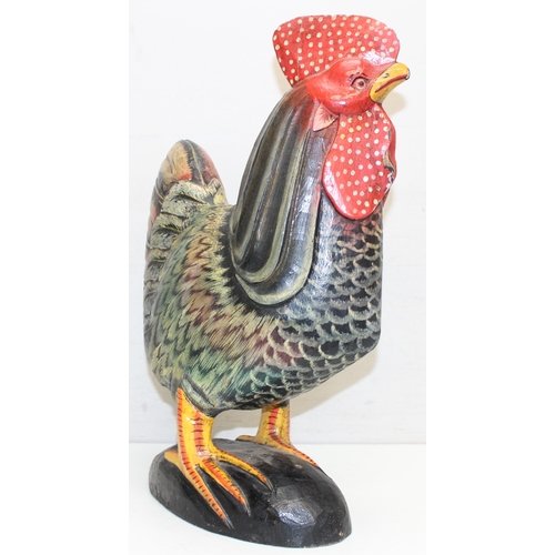 1639 - 2 large folk art style painted carved wooden models of chickens, the largest approx 75cm tall