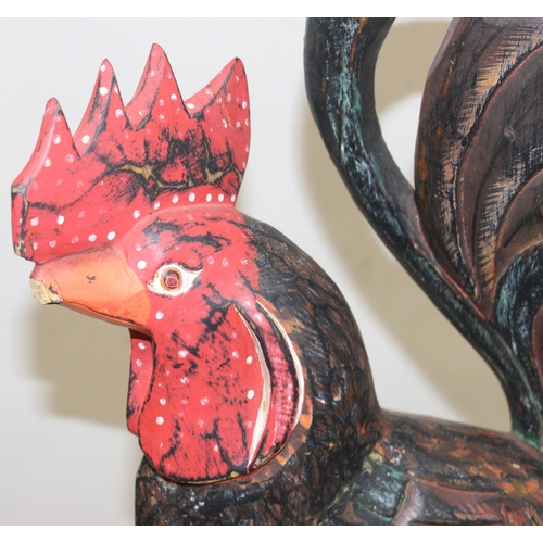 1639 - 2 large folk art style painted carved wooden models of chickens, the largest approx 75cm tall